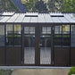 Retro greenhouse with glass panels and metal frame in a garden setting
